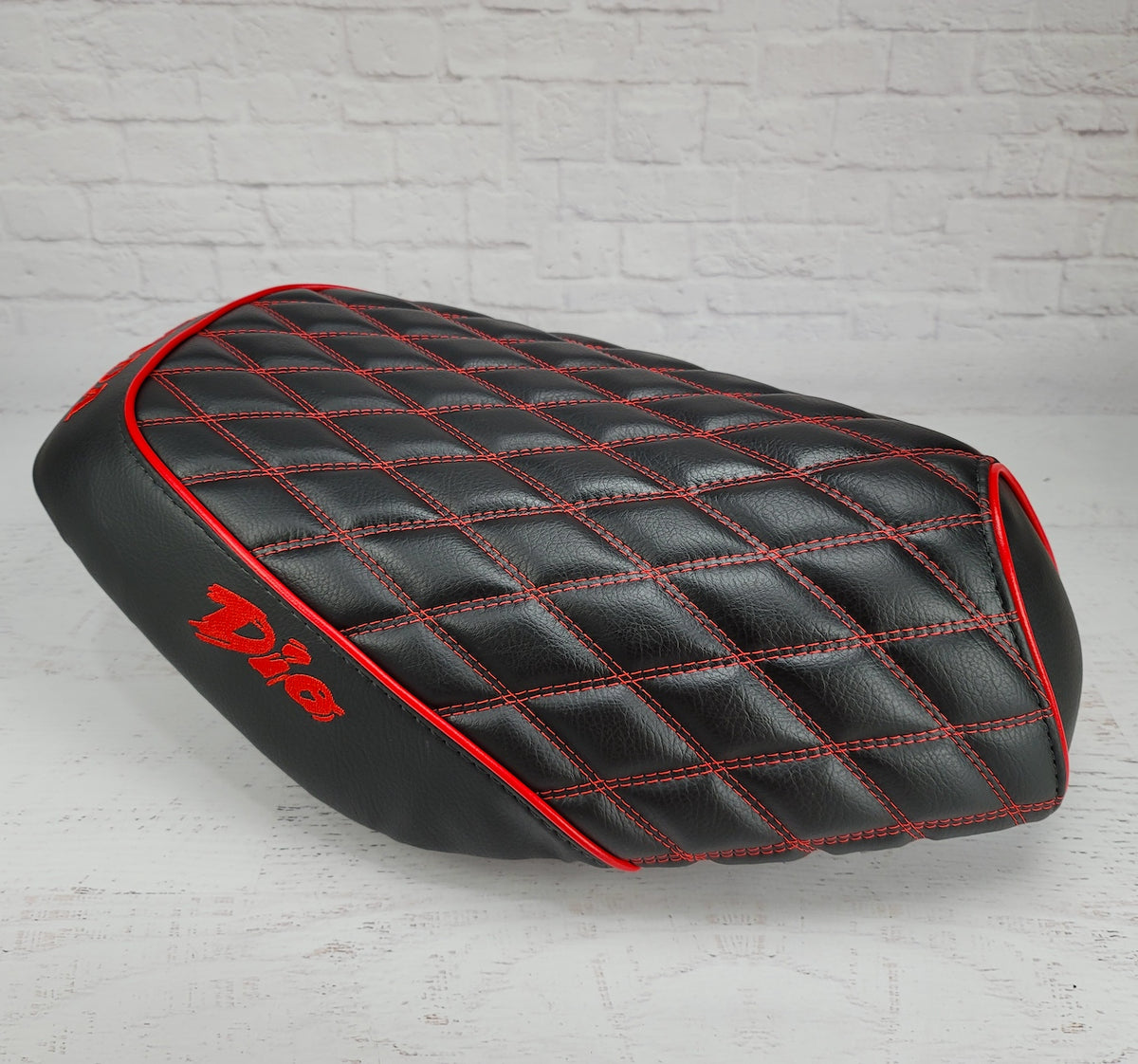 Honda Dio 1 & 2 Diamond Seat Cover with Red Piping, and embroidered Dio logos, handmade by Cheeky Seats