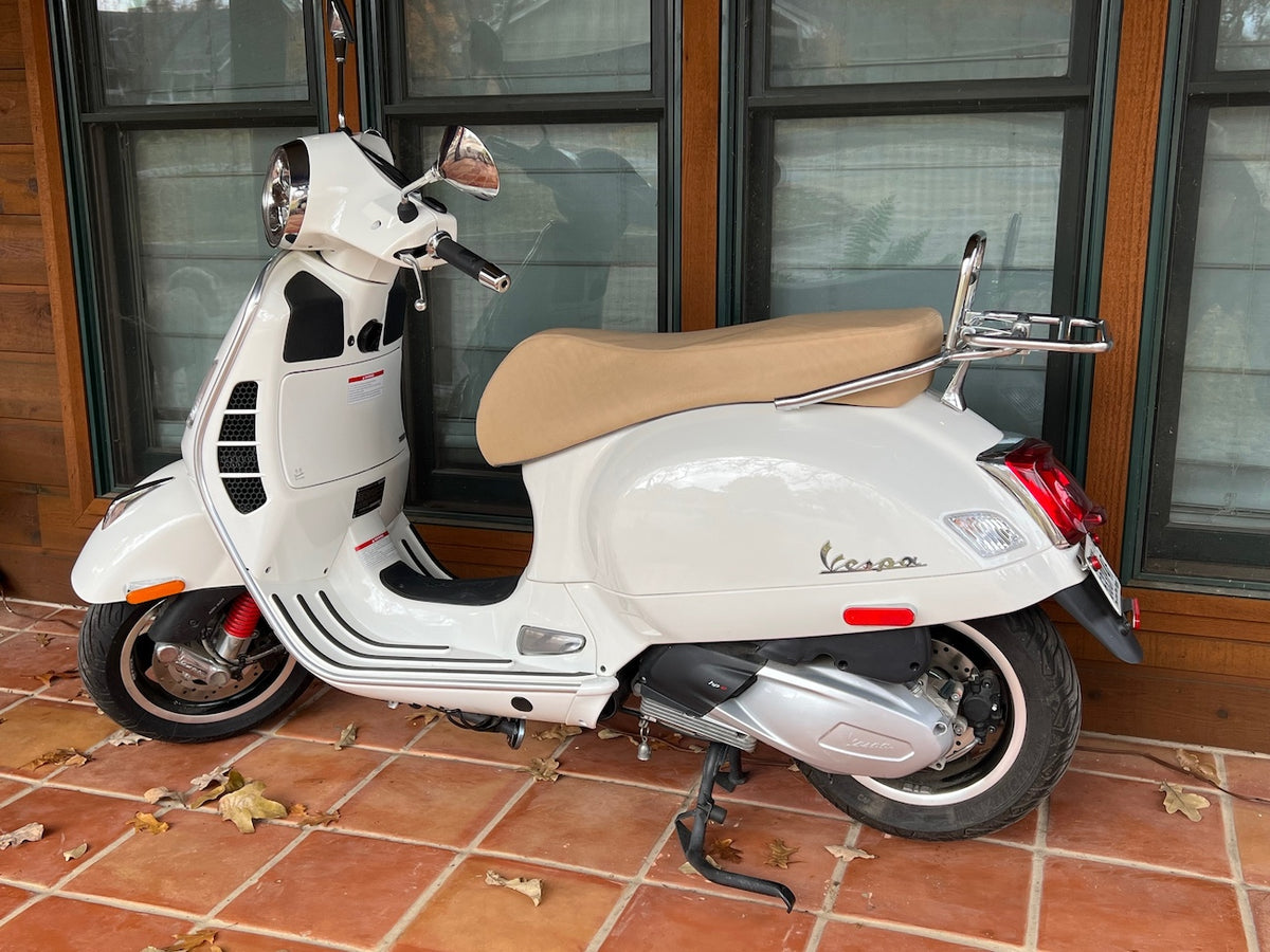 Vespa GTS camel tan seat cover on scooter