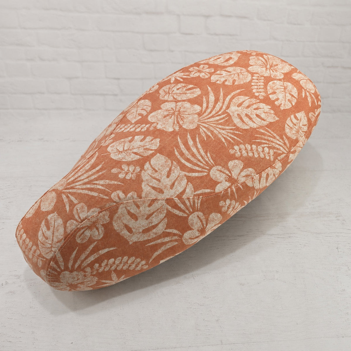 Terracoral Hibiscus scooter seat cover with a sun-washed tropical floral pattern for Vespa, Kymco, Lance and more, handmade by Cheeky Seats.