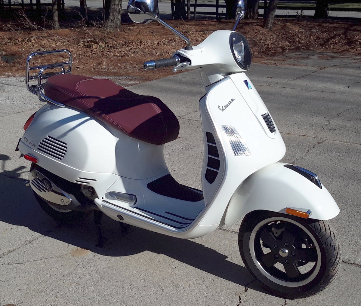 Vespa GTS merlot burgundy seat cover on scooter