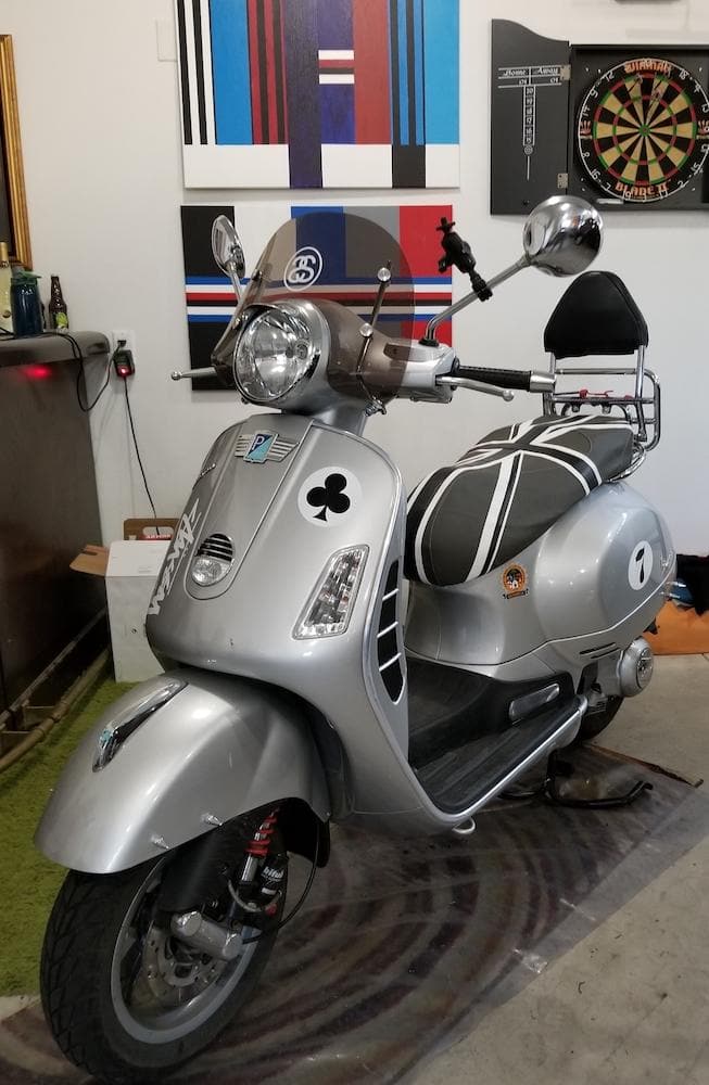 Vespa GTS black and gray Union Jack seat cover on scooter