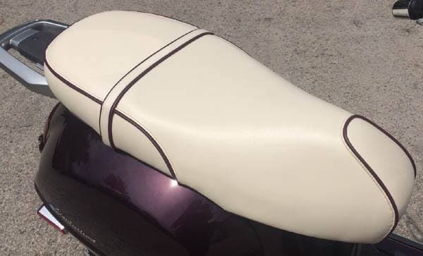 Vespa GT200 cream seat cover with piping on scooter