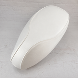 Cottage White seat cover for Vespa Sprint and Primavera, with a clean tailored shape and matching piping, handmade by Cheeky Seats.