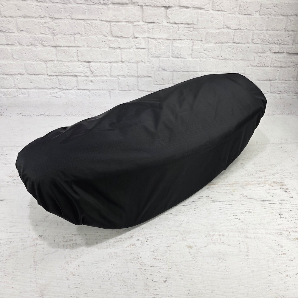 Fully fitted black rain and dust cover shaped around a Honda DAX 125 seat, from Cheeky Seats