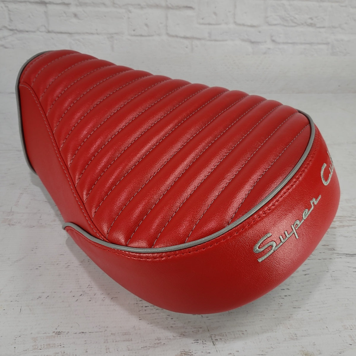 Honda Super Cub red seat cover by Cheeky Seats