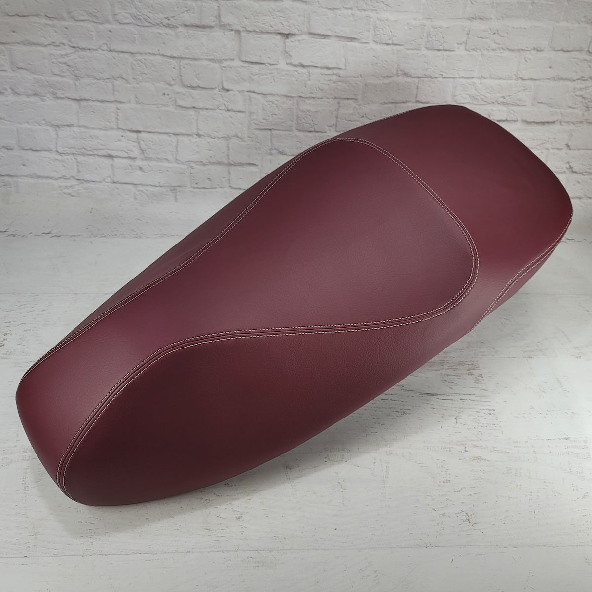 Vespa GTS merlot burgundy seat cover, handmade by Cheeky Seats