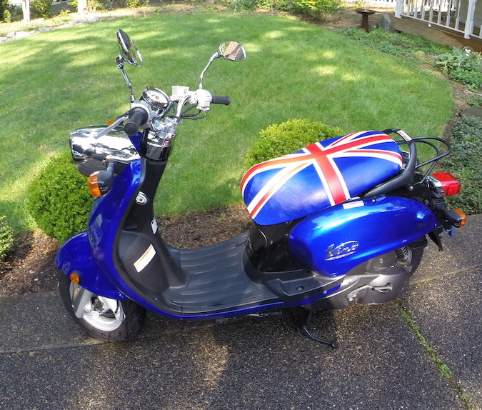 Union Jack seat cover fitted to a blue Yamaha Vino 125, creating a bold British-inspired custom look, handmade by Cheeky Seats.